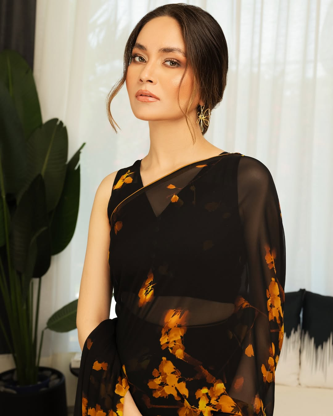 Elegant Black and Orange Floral Silk Blend Saree with Unstitched Blouse